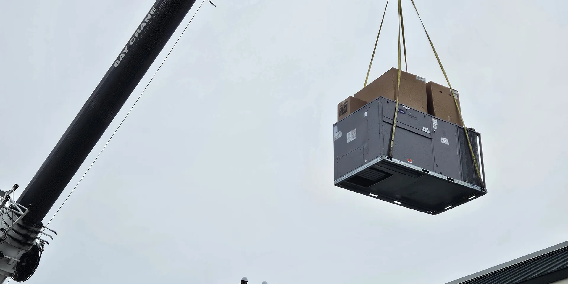 Kern Mechanical crew replacing a packaged rooftop HVAC unit at a Michigan retail store